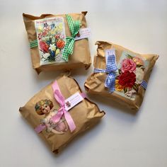 three bags filled with flowers on top of a table