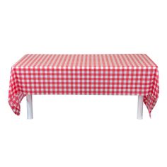 a red and white checkered table cloth on top of a wooden bench with two legs