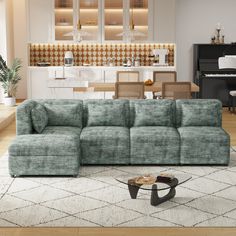 a living room filled with furniture and a piano