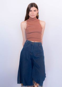 "Vintage 70s boho denim culottes. These great culottes are trending this season and are just perfect for summer style! High-waist fit. X criss-cross belt loops. Front pockets. Back western yoke detail. Wide-leg silhouette. Front button and zipper fastening. Unlined. Cut from 100% cotton. We kindly ask that you please view all measurements for comparison so you can get your desired fit. * Brand: n/a * Decade: 1970s * Fabric: 100% Cotton * Lining: Unlined * Color: Medium Dark Wash C O N D I T I O Summer Cropped Medium Wash Flare Jeans, Summer Cropped Flare Jeans In Medium Wash, Vintage Mid-rise Flare Jeans For Summer, Retro Wide Leg Jeans For Summer, 70s Inspired High Rise Jeans For Spring, 70s Inspired Wide Leg Jeans For Spring, Vintage Cropped Leg Summer Bottoms, Vintage Cropped Leg Bottoms For Summer, 70s Inspired Wide Leg Summer Bottoms