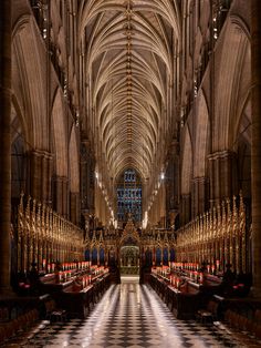 the interior of a cathedral with high vaulted ceilings and checkered flooring is shown