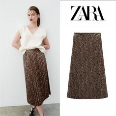 Zara Faux Leather Pleated Snakeskin Skirt Blogger's Fave! Zara Faux Leather Pleated Snakeskin Skirt New With Tags / Completely Sold Out / Hard To Find Size Xs High-Waisted Midi Skirt Side Hidden In-Seam Zip Closure Snake/Tan -Brown Vegan - 100% Polyester (Base Fabric) / 100% Polyurethane (Coating) No Stretch / Please See Measurements Approximate Flat Measurements: Waist: 13" Hips 15” Length: 32” The Photos Don;T Do This Skirt Justice --Super Cute!!! # Rare Snake Croc Animal Print Snakeskin Pleat Zara Lined Brown Skirt, Zara Brown Lined Skirt, Zara Brown Skirt For Fall, Chic Brown Zara Skirt, Zara Brown Skirt For Spring, Snakeskin Skirt, Midi Sweater Skirt, Zara Midi Skirt, Flower Print Skirt