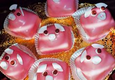 pink and white heart shaped cakes on a gold plate