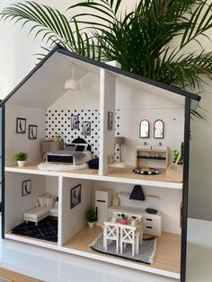 a doll house with furniture and plants in it