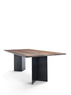 a wooden table with black metal legs