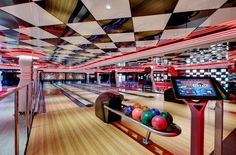 a bowling alley filled with lots of bowling balls