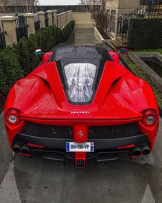 a red sports car parked on the street