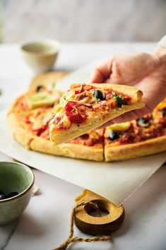 woman holding a slice of homemade mediterranean pizza Mediterranean Pizza, Meatless Meals Healthy, Vegan Mediterranean, Vegan Pizza Recipe, Customization Ideas, Meatless Monday Recipes, Red Onion Relish, Dinner On A Budget, Onion Relish