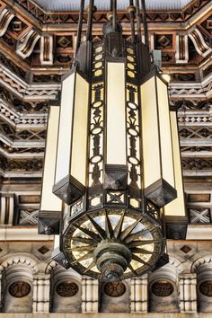 an ornate chandelier hangs from the ceiling