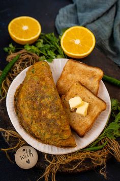 a plate with some food on it and orange slices