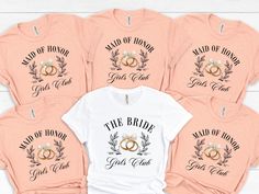 the bride t - shirt bundle is shown in pink and white with matching rings on it