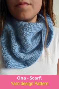 a woman wearing a blue knitted cowl with the words ona scarf, yarn design pattern