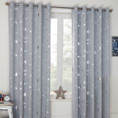 the curtains in this room are decorated with stars