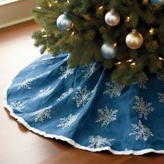 a christmas tree skirt with snowflakes on it