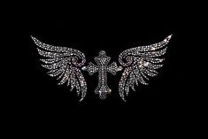 a cross with wings is shown on a black background in this image, it appears to be made out of crystal stones