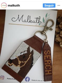 a key chain with a beaded dog on it