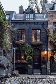 an old brick building with plants growing on it