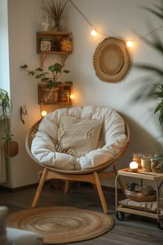 a living room filled with lots of furniture and lights on the wall above it's windows