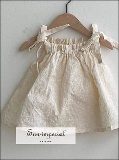 Ivory Kids Tie Cami Strap Embroidery Short Girls Dress SUN-IMPERIAL United States Bowknot Dress, Kids Ties, Draped Collar, Baby Frocks Designs, Summer Pattern, Newborn Dresses, Zulu, Sleeved Romper