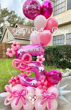 a birthday cake made out of balloons