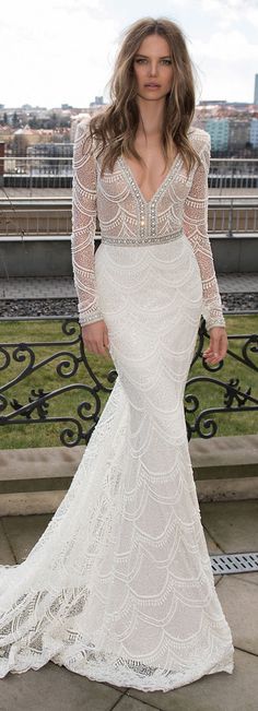 a woman in a white dress posing for the camera