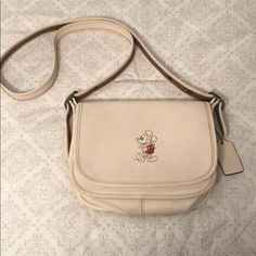 Purse Style: F59359 Patricia. Authentic Coach Disney Mickey Mouse Leather Bag With Shoulder Strap. Adjustable Strap With 22” Drop For Shoulder And Crossbody Wear. Please See Small Scratch On The Back Of Purse As Pictured. Other Than That It’s In Excellent Condition. Comes With Matching Mickey Coach Keychain Retailed At $70. Purse Retailed At $495. Disney Coach, Coach Disney, Purse Style, Coach Keychain, Purse Styles, Disney Mickey Mouse, Disney Mickey, Coach Bags, Leather Bag