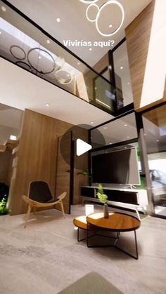 a living room filled with furniture and a flat screen tv mounted to the side of a wall