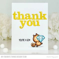 a thank you card with an image of a cat holding a diamond