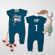 two baby onesuits with fishing one on the front and one on the back