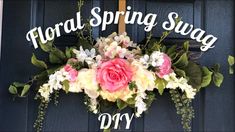 the front door is decorated with flowers and greenery for this spring swag event