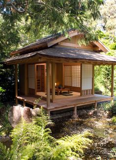 a small japanese style house in the woods