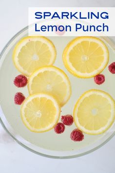 lemons and raspberries are arranged in a glass bowl with the words sparkling lemon punch