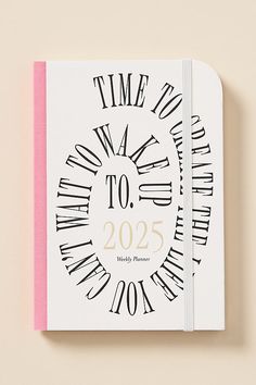 a white and pink notebook with the words time to go on it