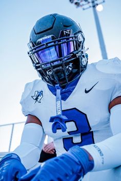 a football player wearing a helmet and gloves