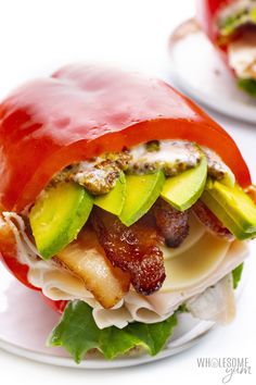 a bacon, avocado and tomato sandwich on a plate