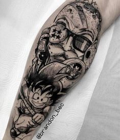 a man's arm with a cartoon character tattoo on it