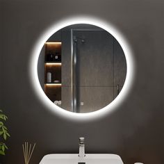 a bathroom sink under a round mirror