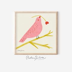 a pink bird sitting on top of a tree branch next to a red heart shaped object