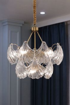 a chandelier hanging from the ceiling in a room