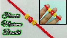 a hand holding a red string with yellow flowers on it and the words flower macrame bracelet