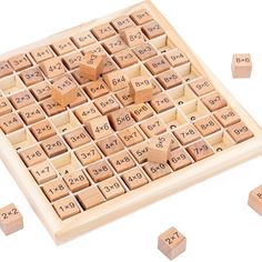 a wooden game with numbers and dices on it