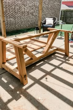 a wooden bench sitting on top of a patio