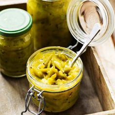 jars filled with pasta and pestles on a wooden tray