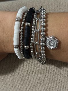 **Black & White Neutral Bracelet Stack - Perfect Gift for the Hard-to-Buy-For Person** This stylish black and white neutral bracelet stack is a versatile addition to any jewelry collection. Whether you're dressing up for a special occasion or adding a subtle touch of elegance to your everyday look, these bracelets are designed to elevate any outfit. The combination of black and white tones makes it a timeless piece that pairs perfectly with any color. **Features - Elegant stack of 6 bracelets fe Neutral Bracelets, Chic Bracelet, White Bracelets, Stackable Bracelets, Elegant Accessories, Initial Charm, Perfect Christmas Gifts, Bracelet Stack, Minimalist Jewelry