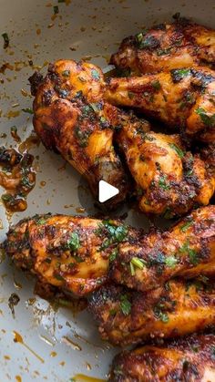 grilled chicken wings with herbs and seasoning in a bowl