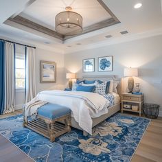 a bedroom with blue and white decor in it