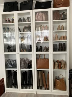 a closet filled with lots of shoes and bags