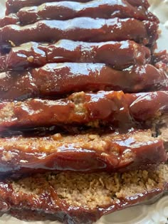 meatloaf on a plate with brown rice and sauce