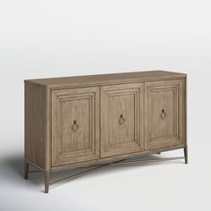 This sideboard delivers a touch of farmhouse charm and a whole lot of storage to your dining room. Its weathered solid and engineered wood construction contrasts with the bronze-finished base and ring pulls for subtle visual interest. Three cabinet doors with picture-frame paneling open to reveal plenty of interior space to store dinnerware and table linens. Plus, the top is just right for displaying décor or rolling out a buffet. Comes with a wall anchor for extra stability. Birch Lane™ Birch L Ring Pulls, Wide Sideboard, Blanket Basket, Curtain Hardware, Decor Display, Sideboard Buffet, Birch Lane, Floor And Wall Tile, Wood Construction