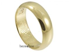 a gold wedding ring with an engraved fingerprint on the outside and inside, is shown